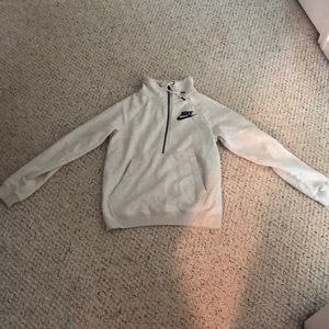 A light grey Nike sweatshirt